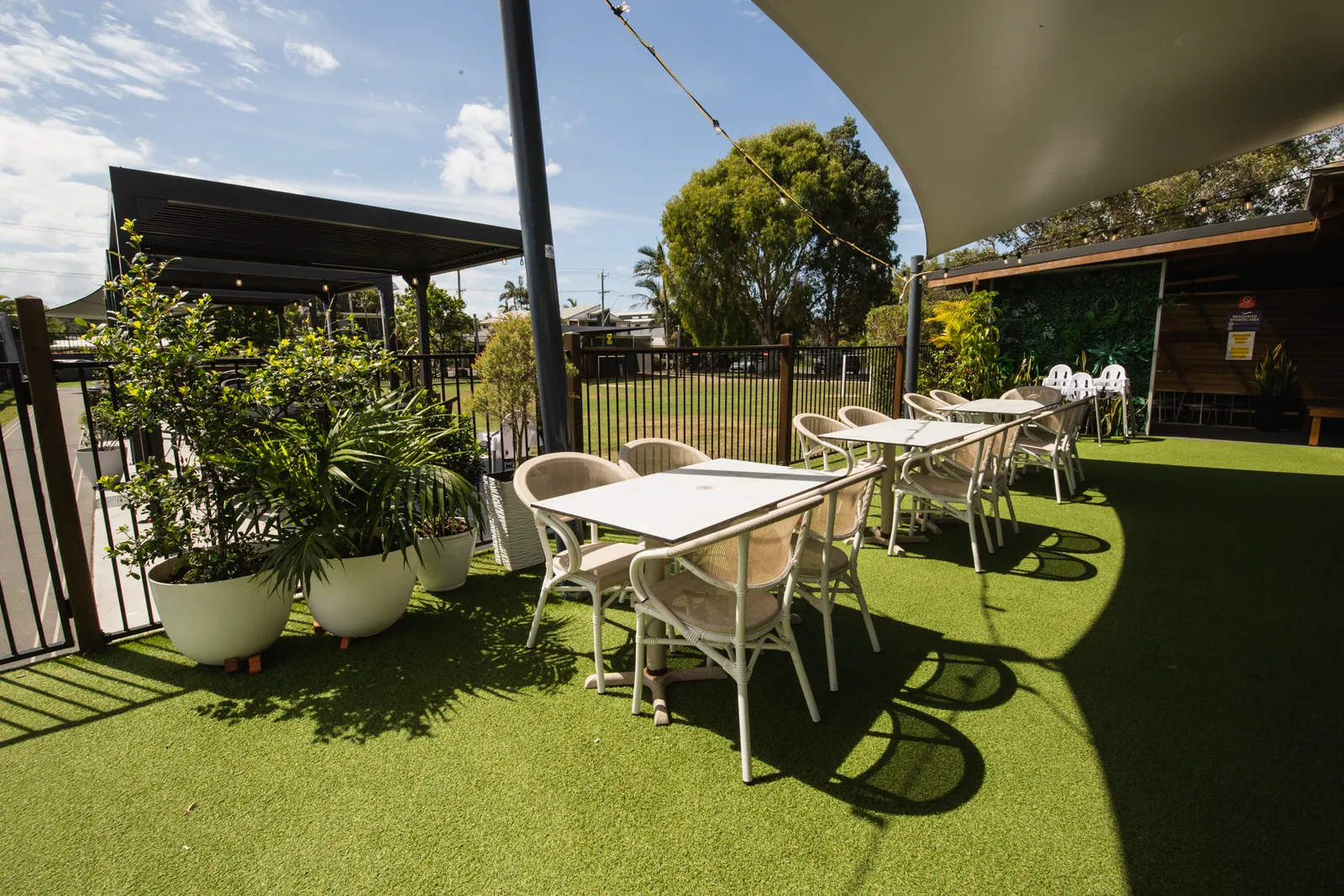 Beer garden dining tables by the greens