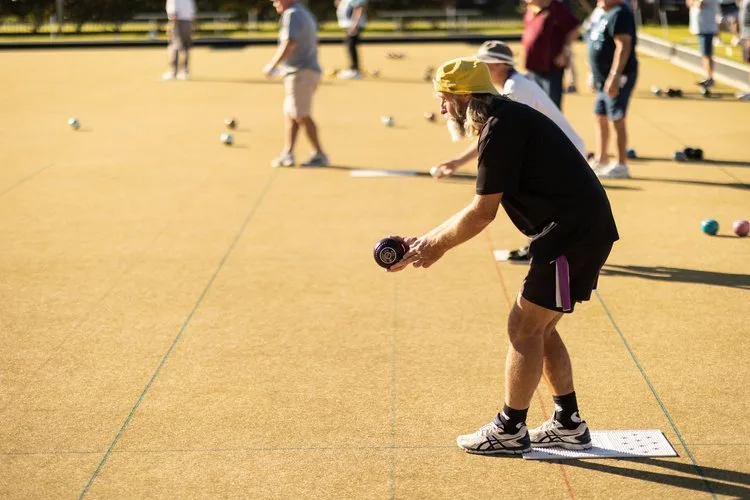 A bowler delivering down the rink in the finals