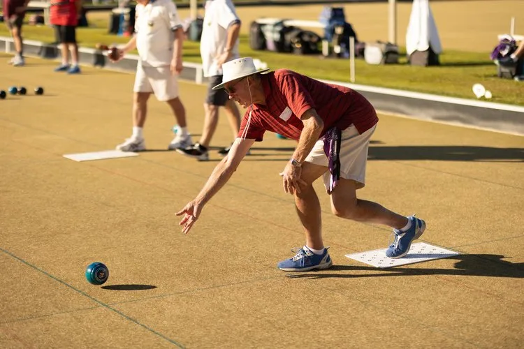 Players lining up a shot on the green