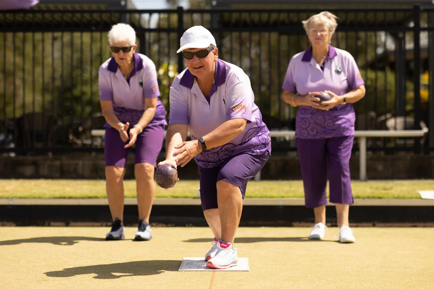 Players and spectators around the green